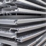 custom aluminum extrusion profiles stacked up on a shelf in a warehouse