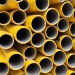 finishing touches - photo of yellow anodized aluminum hollow rods in a stack to represent different types of finishing solutions