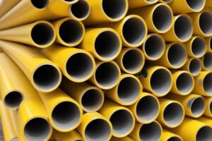 finishing touches - photo of yellow anodized aluminum hollow rods in a stack to represent different  types of finishing solutions