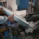 closeup of a worker holding a custom aluminum profile
