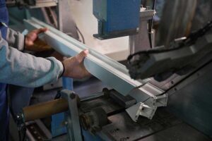 closeup of a worker holding a custom aluminum profile