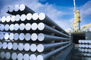 wide angle shot of solid standard aluminum rods with a blue sky and clouds in the background